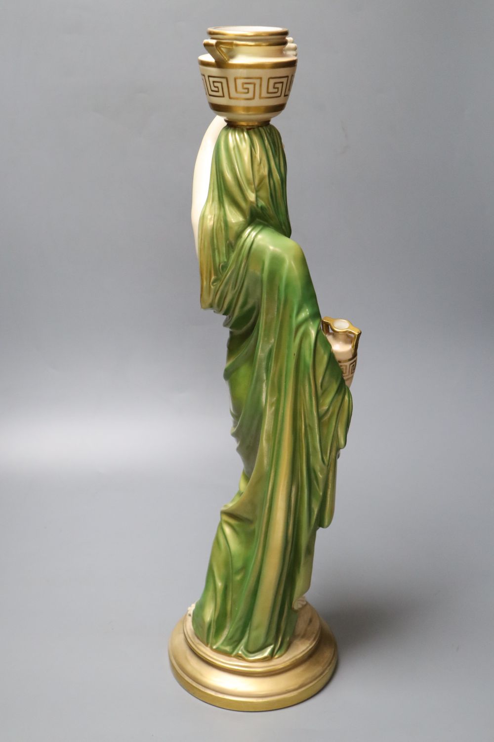 A large Royal Worcester figure of a female water carrier, early 20th century, 52cm